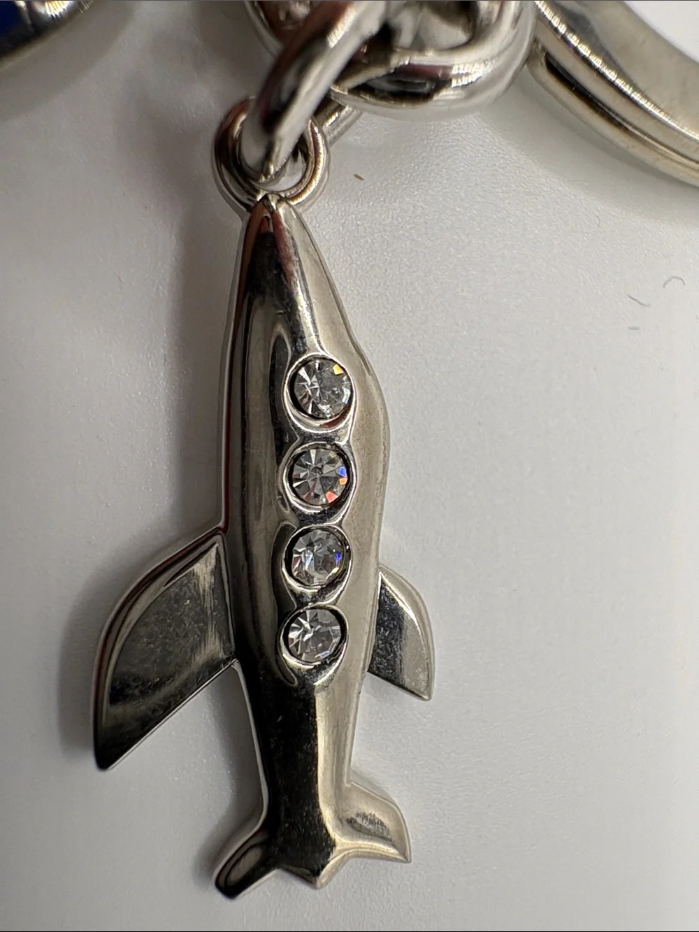 Coach Silver Airplane Keychain with Navy Enamel Glob Charm